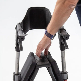 Triumph Mobility Escape rollator walker with a lightweight aluminum frame, padded seat, ergonomic backrest, anatomical handgrips, four 8-inch wheels, and a foldable shopping bag beneath the seat.