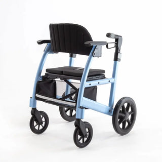 Triumph Prestige all-in-one rollator and transport chair with a black padded seat, padded backrest, ergonomic handgrips, armrests, four wheels, and integrated footrests in transport chair configuration.