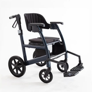 Light blue Triumph Prestige all-in-one rollator and transport chair with a black padded seat, padded backrest, ergonomic handgrips, armrests, four wheels, and integrated footrests in transport chair configuration.