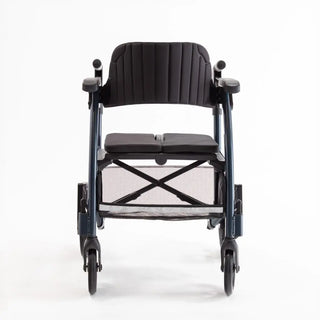 Light blue Triumph Prestige all-in-one rollator and transport chair with a black padded seat, padded backrest, ergonomic handgrips, armrests, four wheels, and integrated footrests in transport chair configuration.