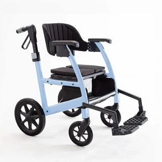 Light blue Triumph Prestige all-in-one rollator and transport chair with a black padded seat, padded backrest, ergonomic handgrips, armrests, four wheels, and integrated footrests in transport chair configuration.