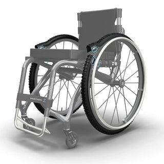 Pair of black reTyre Traction Skins attached over wheelchair tires with rugged tread and Velcro fasteners for improved traction on snow, slush, rain, grass, and gravel.