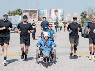 VIPAMAT Hippocampe Marathon wheelchair in a group run on a city street