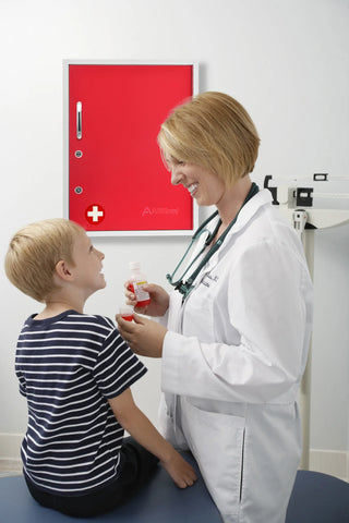 Viva Comfort ADI999-06 red door cabinet on an exam room wall behind a clinician and child