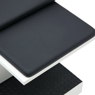 Viva Comfort ADI996-09 Grande exam table close-up of the black seat cushion edge above the textured step surface