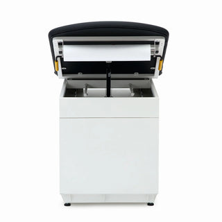 Viva Comfort ADI996-09 Grande exam table end view with the black backrest raised, showing the paper roll and storage area
