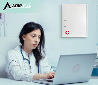 Viva Comfort ADI999-04-WHI white cabinet on a wall behind a clinician working at a laptop