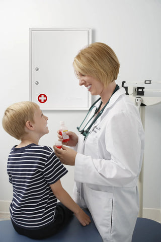 Viva Comfort ADI999-04-WHI white cabinet on an exam room wall behind a clinician and child