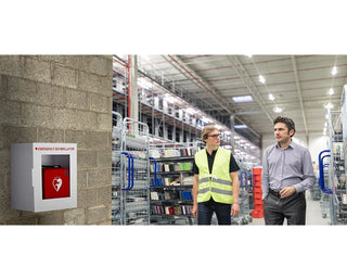 Viva Comfort ADI999-01 AED cabinet mounted on a warehouse wall with two workers nearby