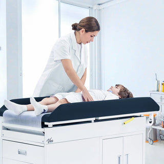 Viva Comfort ADI996-09-PMB Pediatric Grande exam table with a clinician and child in a bright clinic