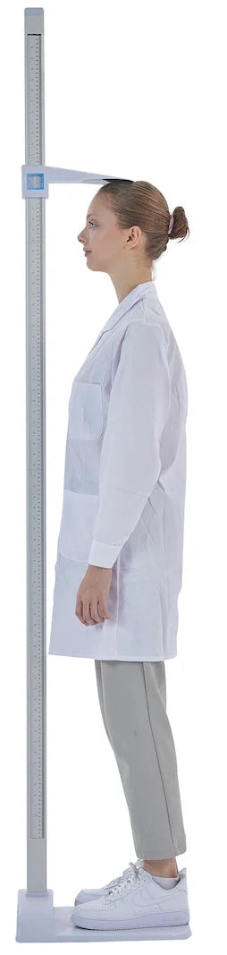 Viva Comfort ADIME907-01 woman in a lab coat standing against the rod for a height check, side view