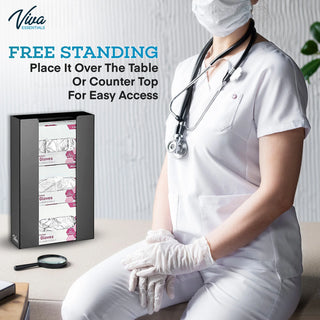Viva Comfort ADI902-03 black glove dispenser standing on a counter beside a seated nurse