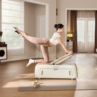 Woman working her legs on the WalkingPad B2 Pilates bench at home