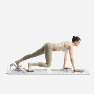Woman holding a plank position on the WalkingPad C1 Pilates board