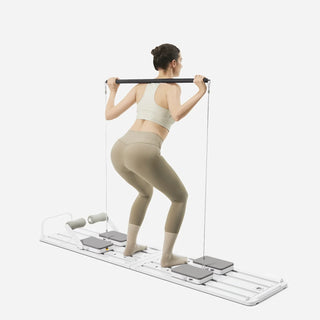 Woman training with the Pilates bar while standing on the WalkingPad C1 board