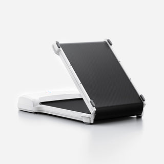 WalkingPad C1 walking machine half folded, showing the hinge in the deck