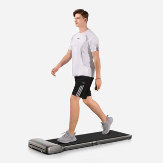 Man walking on the WalkingPad C1 walking machine