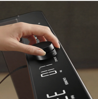 Hand turning the SpeedDial knob on the WalkingPad Denise Austin 2.0 console