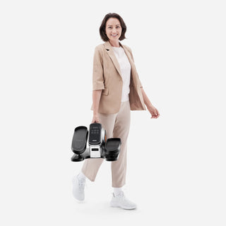 Woman carrying the WalkingPad E1 under desk elliptical by its handle