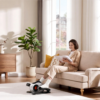 Woman using the WalkingPad E1 elliptical from an armchair