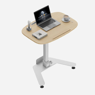 White oak WalkingPad ETD5 standing desk set up with a laptop