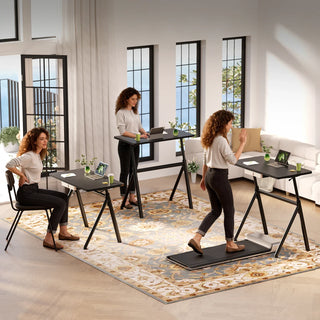 Three people working at WalkingPad ETD6 desks set at different heights