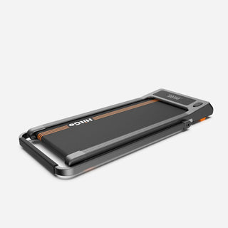 WalkingPad H1 treadmill in flat walking pad mode with the handrail folded down