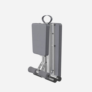 Rear view of the gray WalkingPad MATE-FB1 weight bench folded down