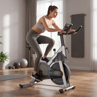 Woman riding the WalkingPad MRB2 exercise bike in a living room