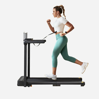 Woman running on the WalkingPad MX10 treadmill with the side handles folded out
