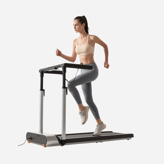 Woman running on the WalkingPad MX3 treadmill holding the handrail