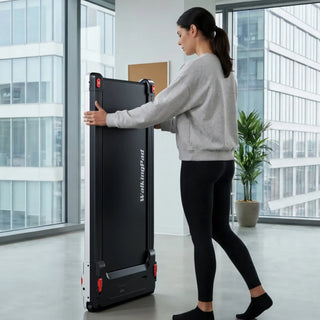 Woman lifting the WalkingPad Massage Step treadmill upright to move it