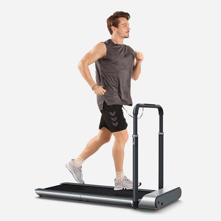 Man running on the WalkingPad R1 Pro treadmill with the handrail raised