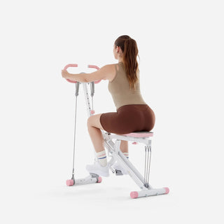 Woman performing a seated pull on the WalkingPad RIDER003 training machine