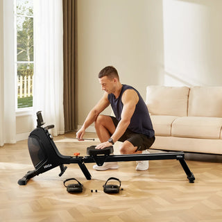 Man assembling the footrest of the WalkingPad RM1 on a living room floor