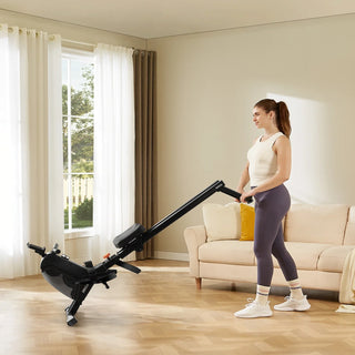 Woman folding the WalkingPad RM1 upright for storage