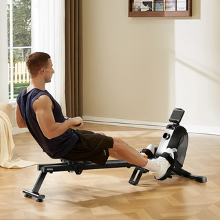 Man rowing on the WalkingPad RM1 in a living room