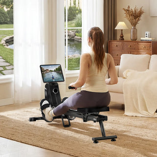 Woman rowing on the WalkingPad RM1 with a tablet on the holder