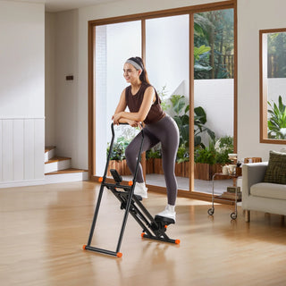 Woman climbing on the WalkingPad SC1 stair stepper beside a window