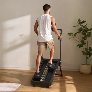 Man climbing on the WalkingPad Stair Stepper at home, seen from behind