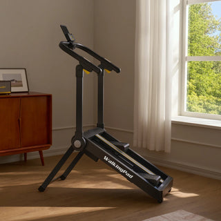 WalkingPad Stair Stepper set up beside a window in a living room