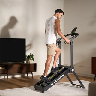 Man training on the WalkingPad Stair Stepper, seen from a rear angle at home