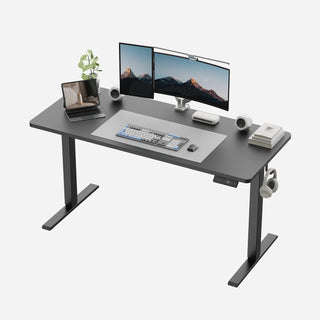 Black WalkingPad two-piece standing desk set up with two monitors and a laptop