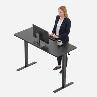 Woman working standing at the WalkingPad two-piece electric standing desk