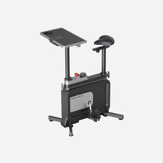 WalkingPad W1B foldable exercise bike in gray with its work surface fitted