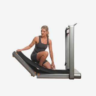 Woman folding the deck of the WalkingPad X214 treadmill