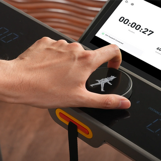 Hand turning the SpeedDial knob on the WalkingPad X214 console