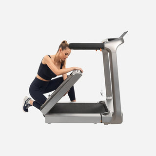 Woman folding the deck of the WalkingPad X218 treadmill