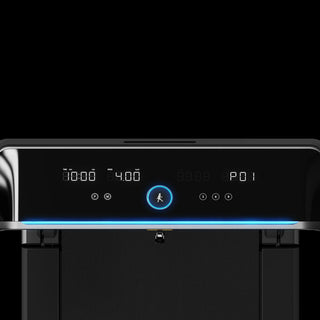 WalkingPad X218 console lit up with the light bar in a dark room