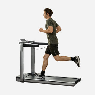 Man running on the WalkingPad X25 Plus treadmill with the side handrails out